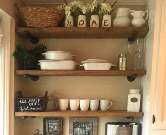 reclaimed wooden shelves with floating industrial pipe shelf brackets