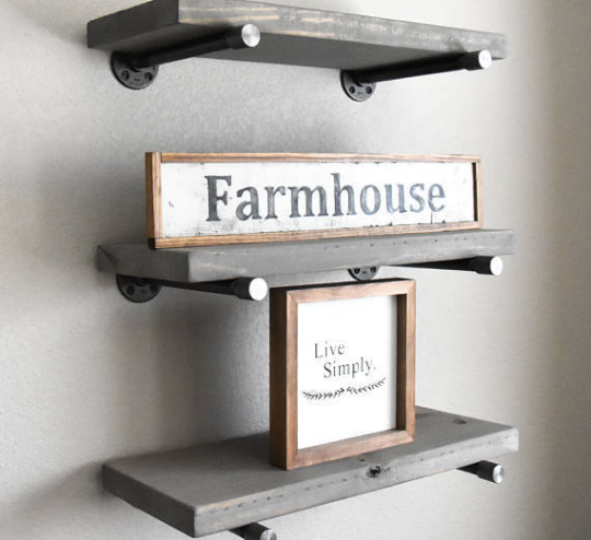 reclaimed wooden shelves with floating industrial pipe shelf brackets