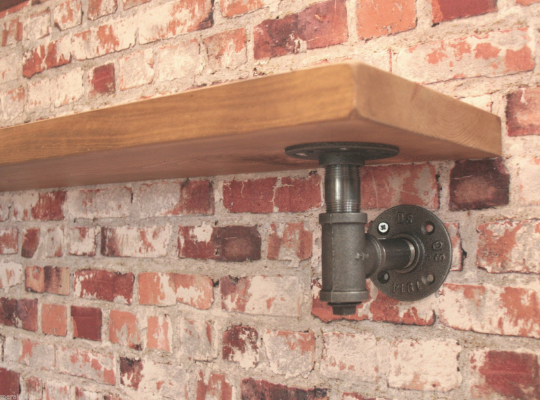 reclaimed wooden shelf with industrial steel pipe brackets