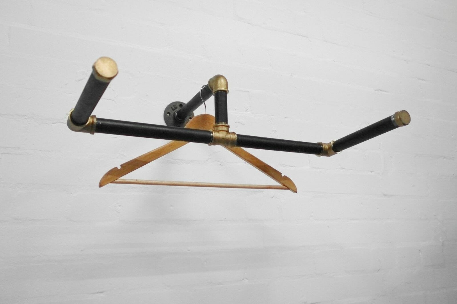 industrial steel pipe black and brass wall mounted scorpion clothes rail