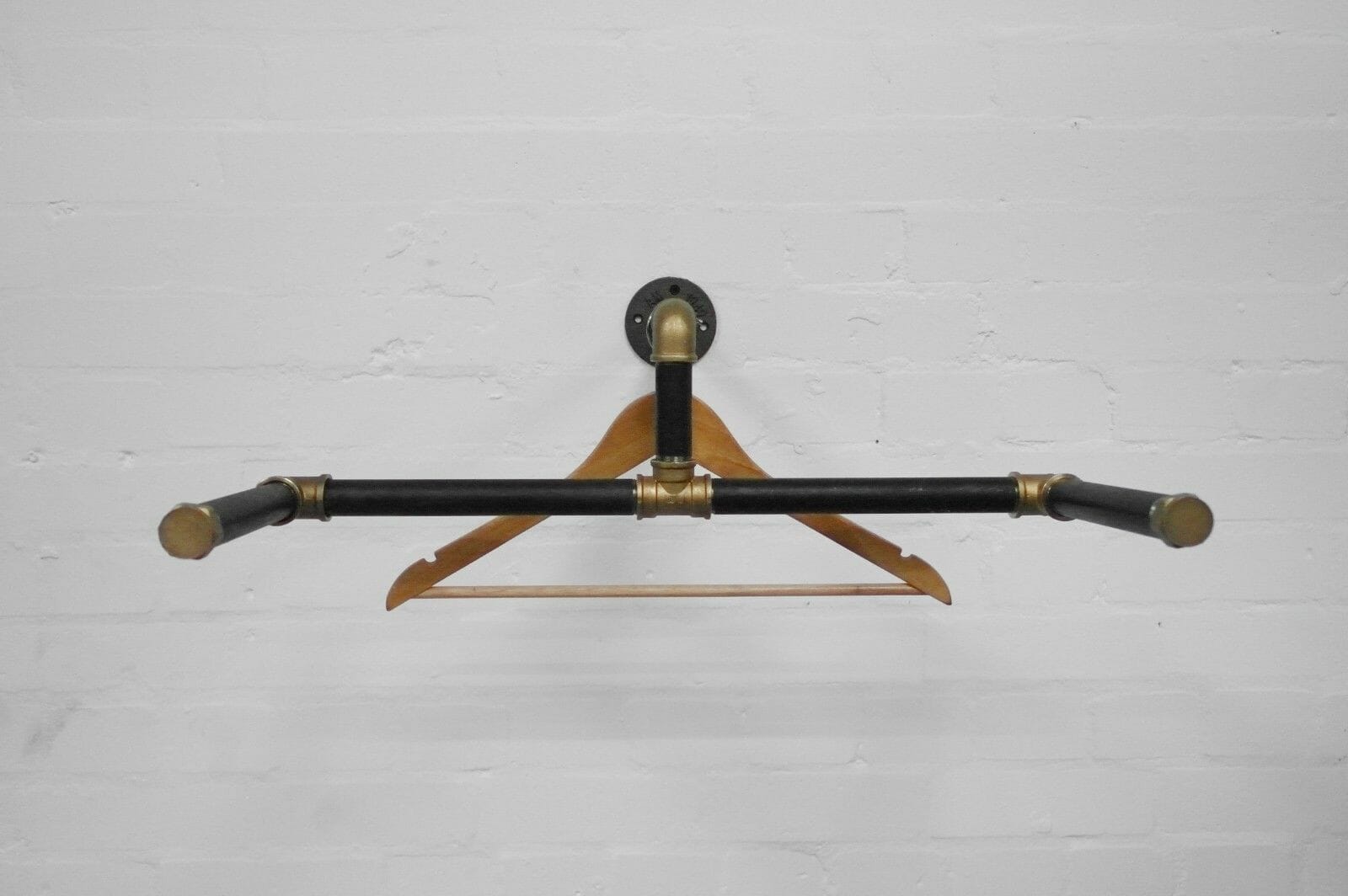 industrial steel pipe black and brass wall mounted scorpion clothes rail
