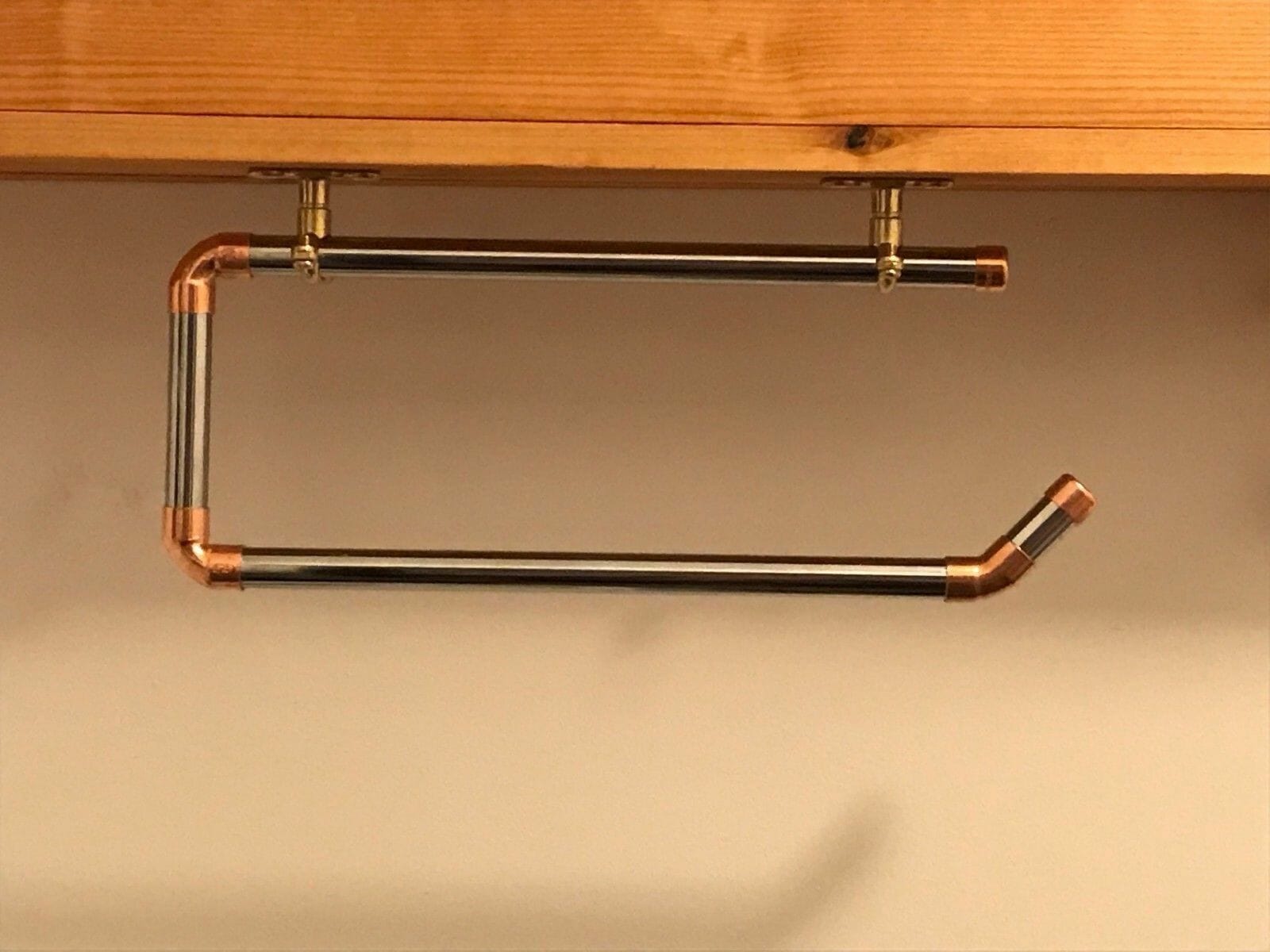 chrome and copper industrial pipe under cupboard kitchen roll holder