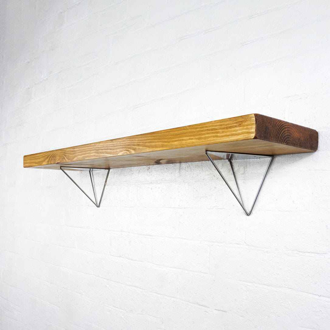 Industrial silver hairpin shelf brackets with reclaimed wooden shelf