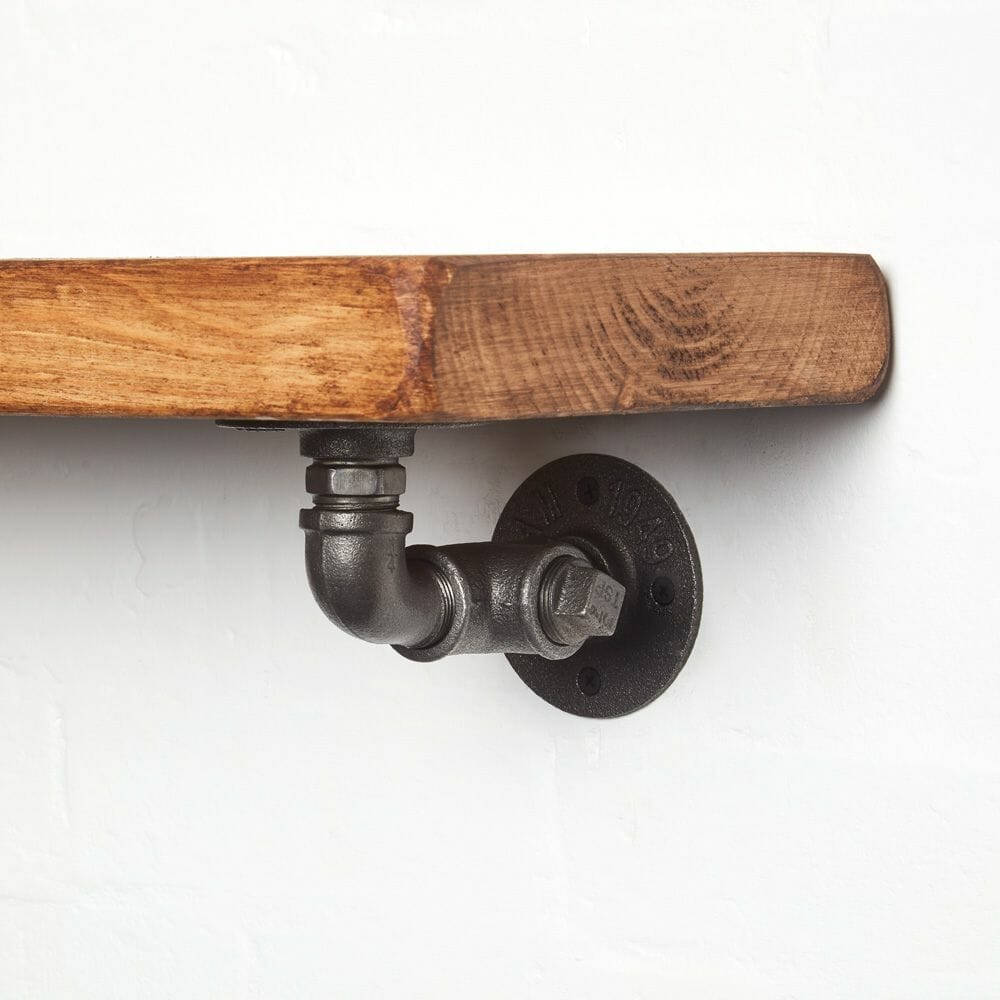 raw steel industrial pipe shelf bracket detailing reclaimed wood shelf close up