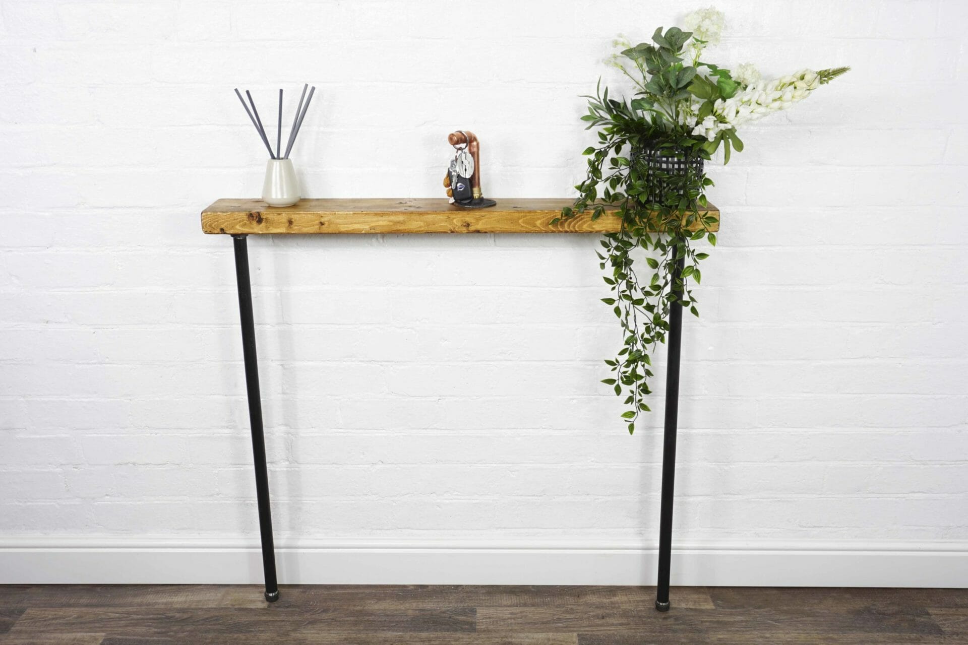 Console table with black steel industrial pipe legs and reclaimed wood tops