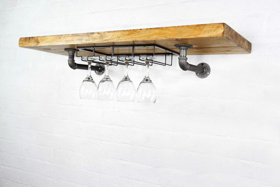 Reclaimed wood wine rack with industrial steel pipe brackets