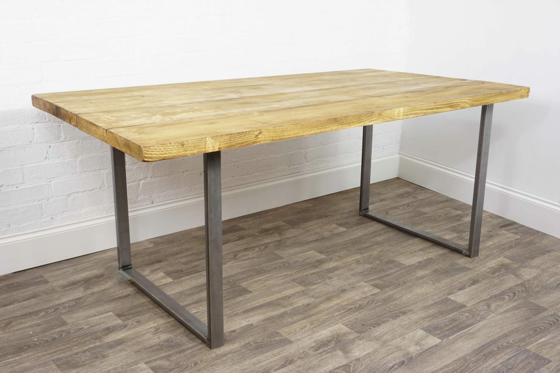 Reclaimed wooden kitchen table with raw steel legs