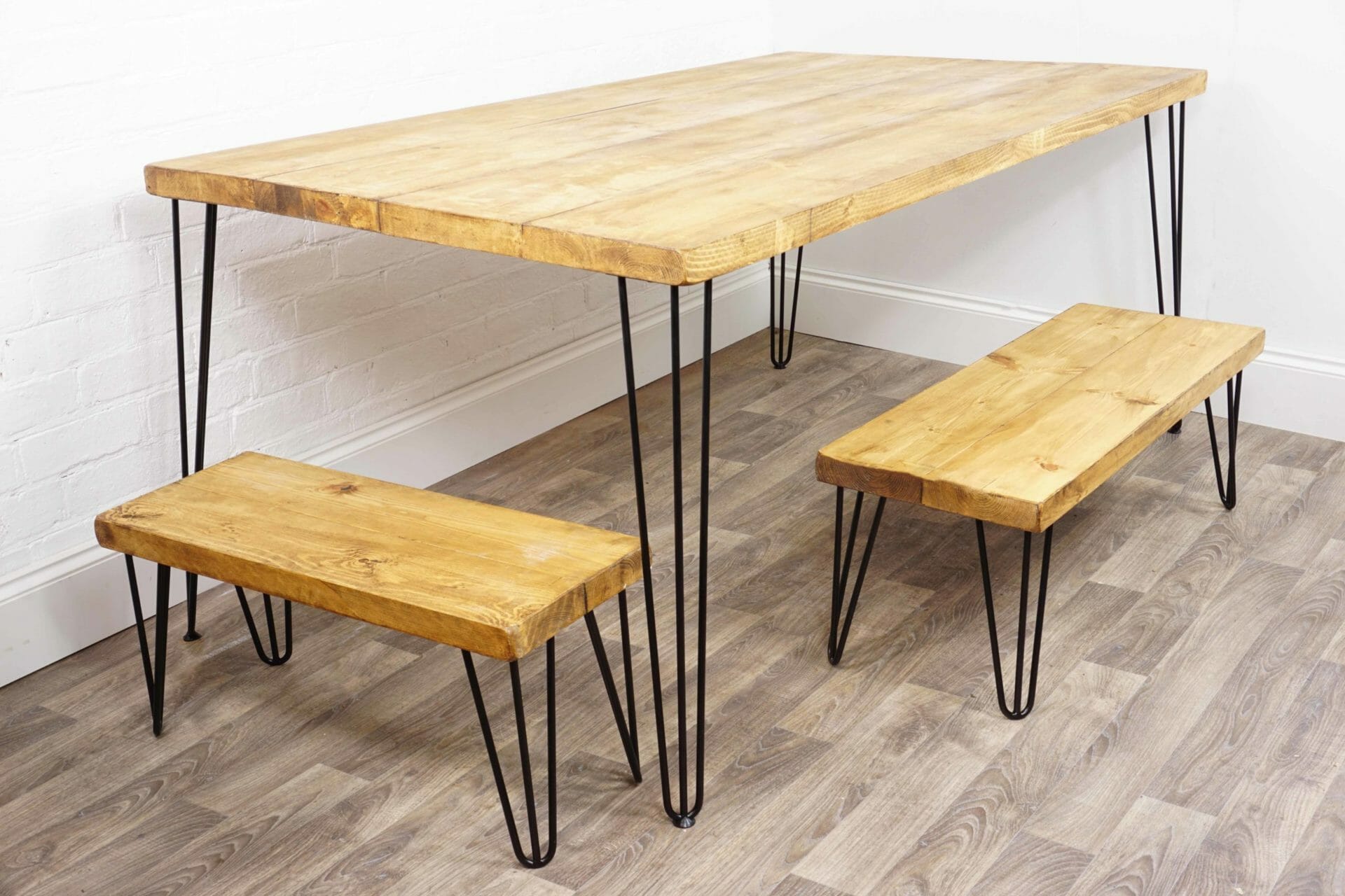 Reclaimed wooden kitchen table with black steel hairpin legs and matching benches
