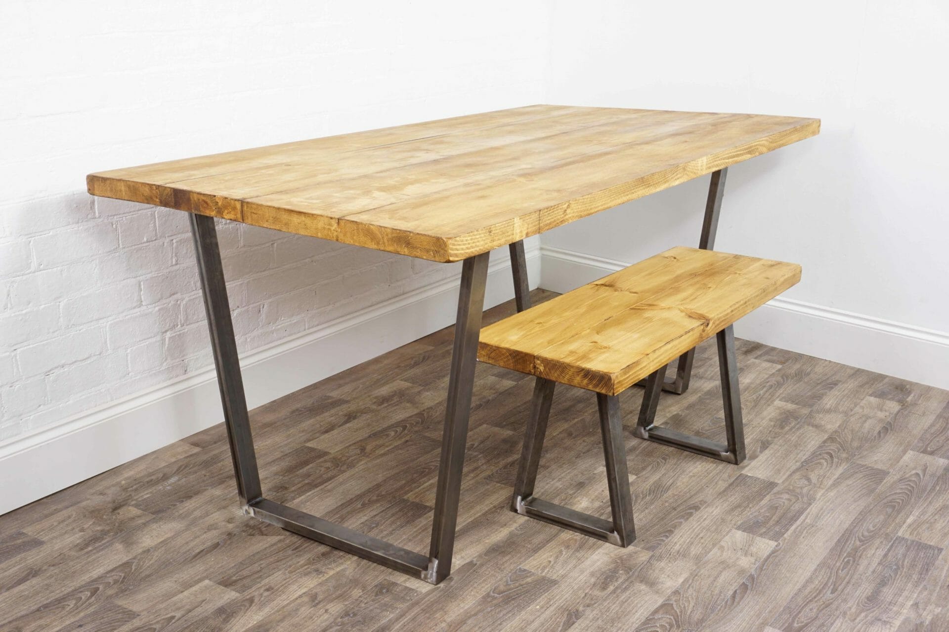 reclaimed wooden table with reverse trapezium raw steel legs with matching bench