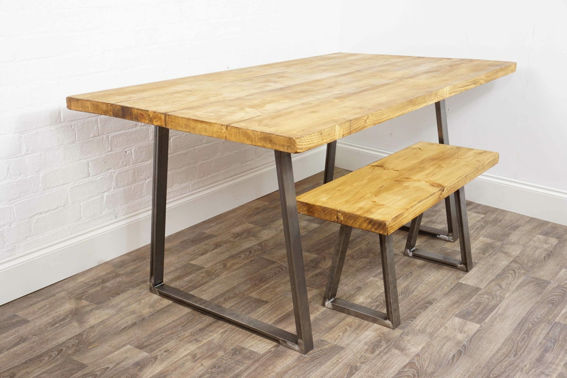 reclaimed wooden table with reverse trapezium raw steel legs