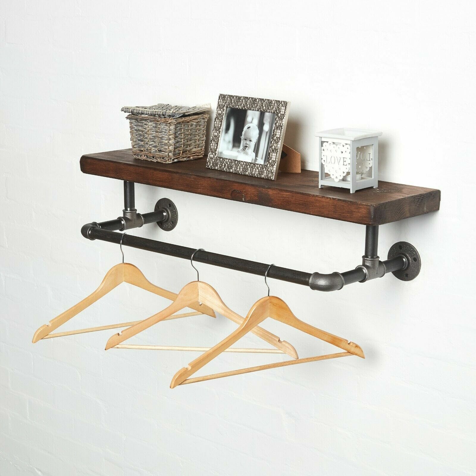 raw steel industrial pipe shelf with elbows, hanging rail and dark wood reclaimed shelf